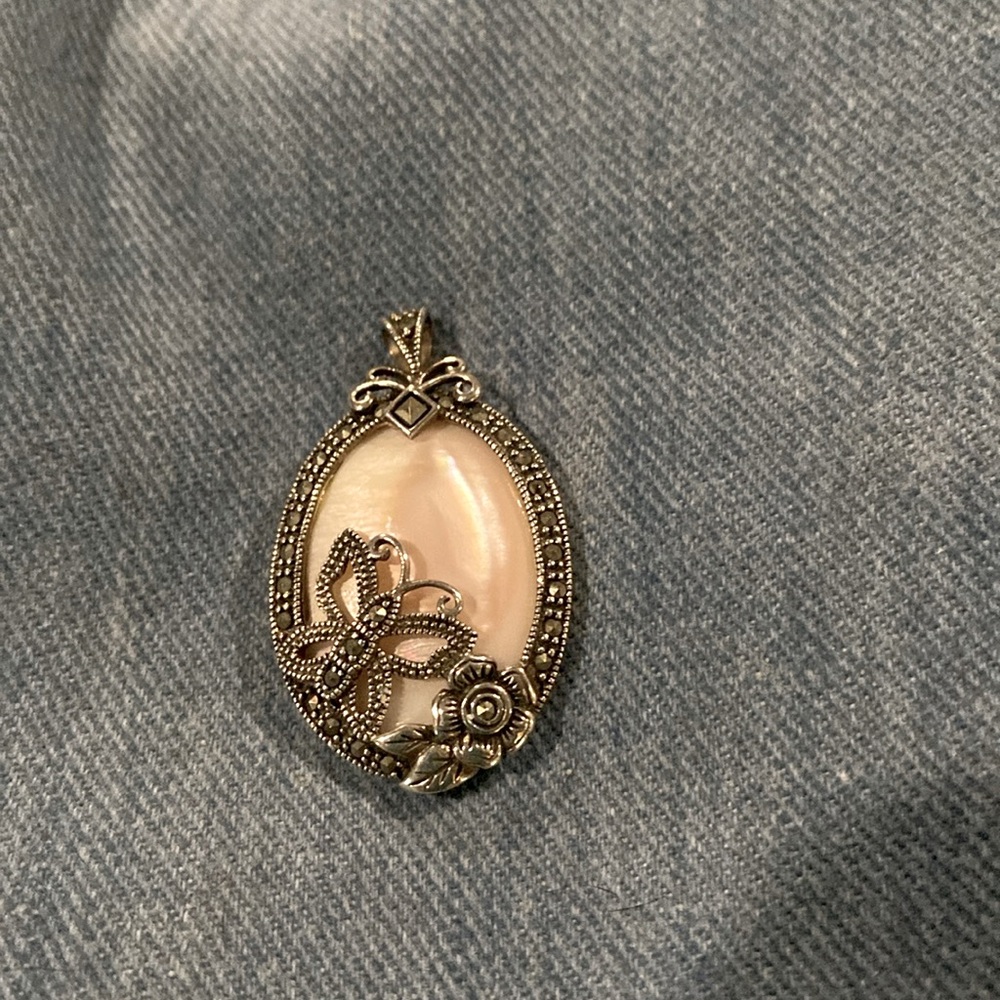 Sterling silver pendant with pink stone